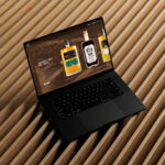 Copper Rivet branded website assets displayed on a laptop, showcasing spirits product pages and bottle designs.