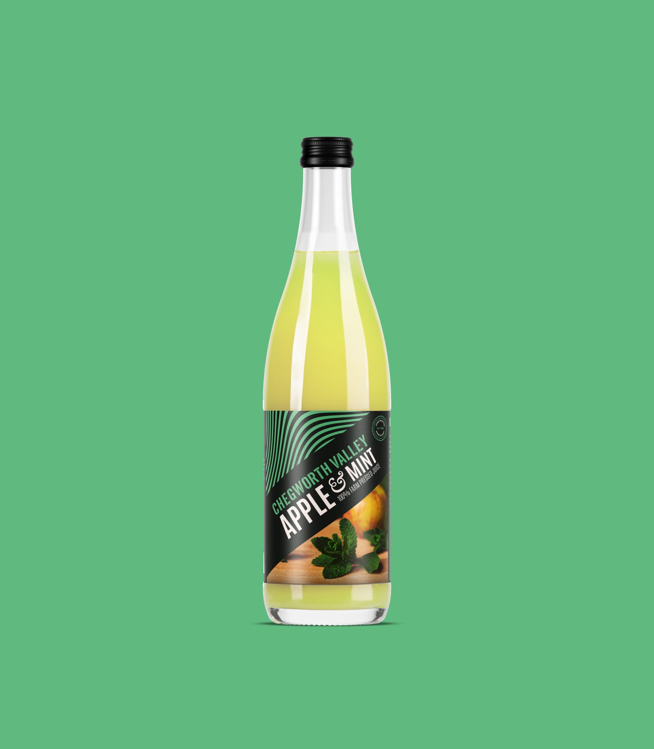 Chegworth Valley apple and mint juice bottle, branded glass packaging, farm-pressed English apple juice on green background.