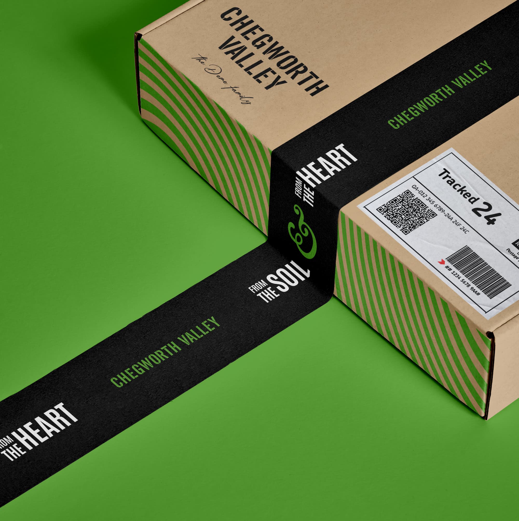 Chegworth Valley branded cardboard box with green striped packaging and black paper band reading “From the soil to the heart,” on a green background.