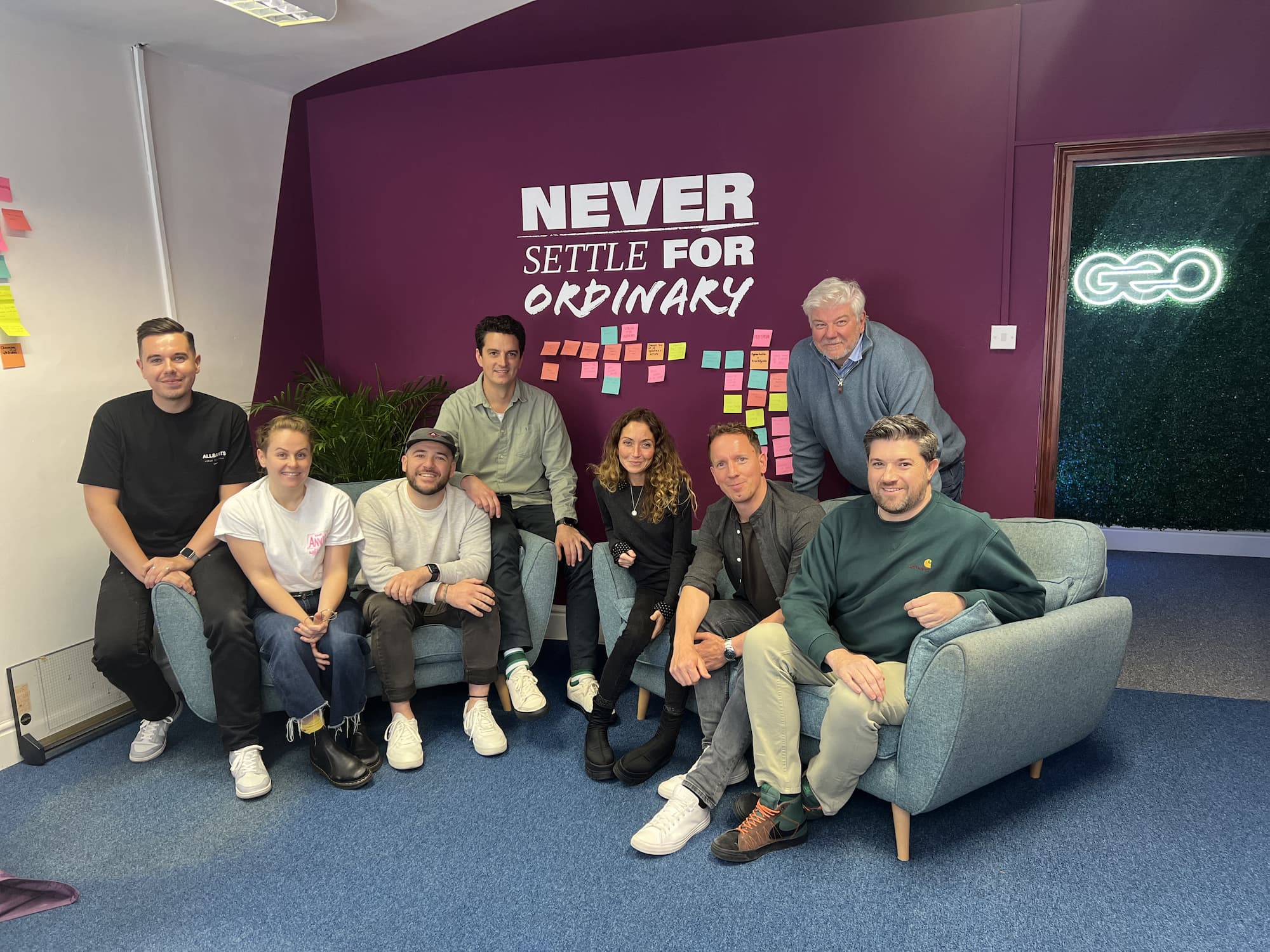 Sownd Affects team collaboration photo with branding partners, showing a group seated in a studio.