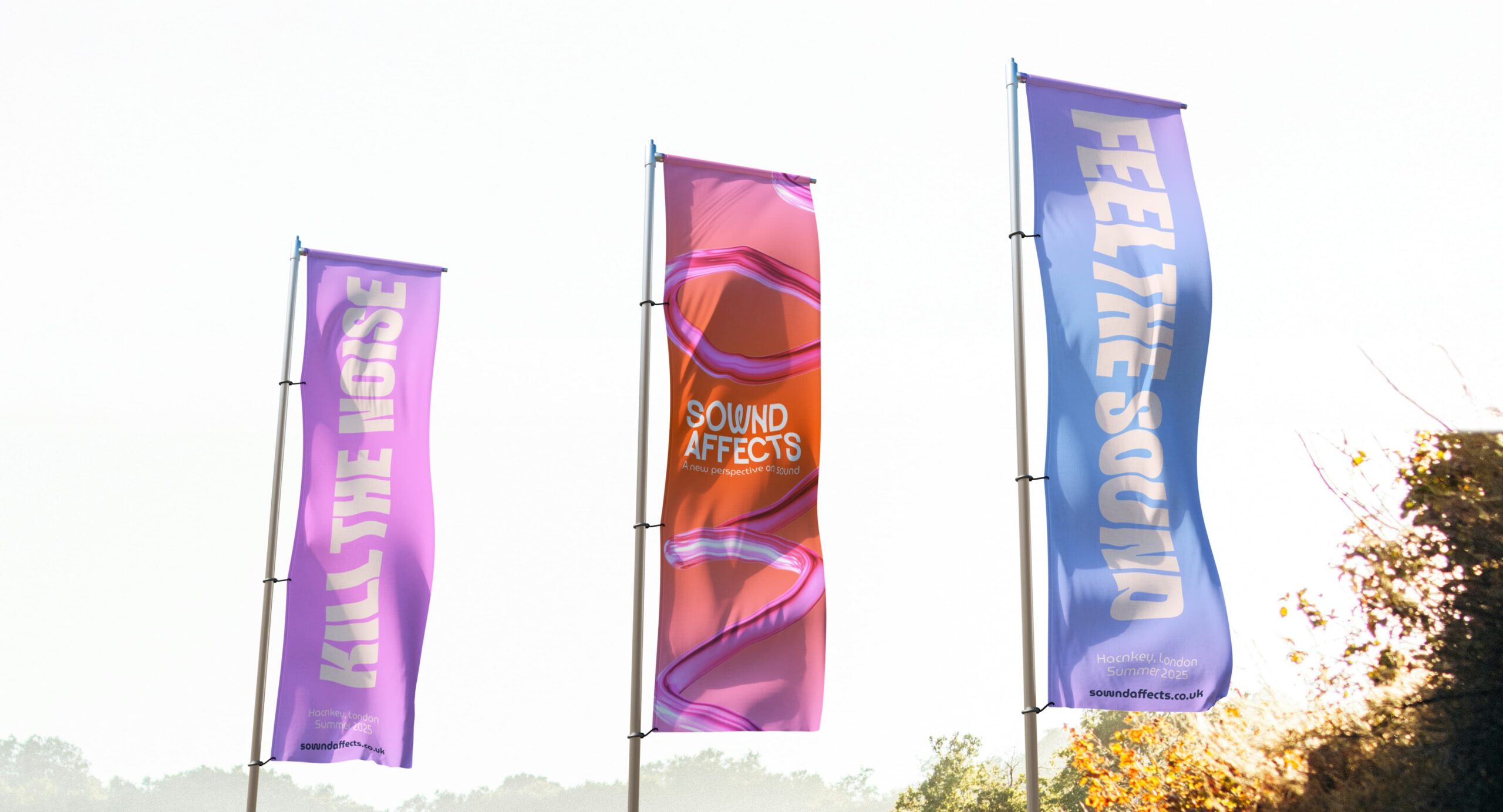 Sownd Affects branded outdoor banners featuring sound wave graphics and festival messaging displayed on flagpoles.