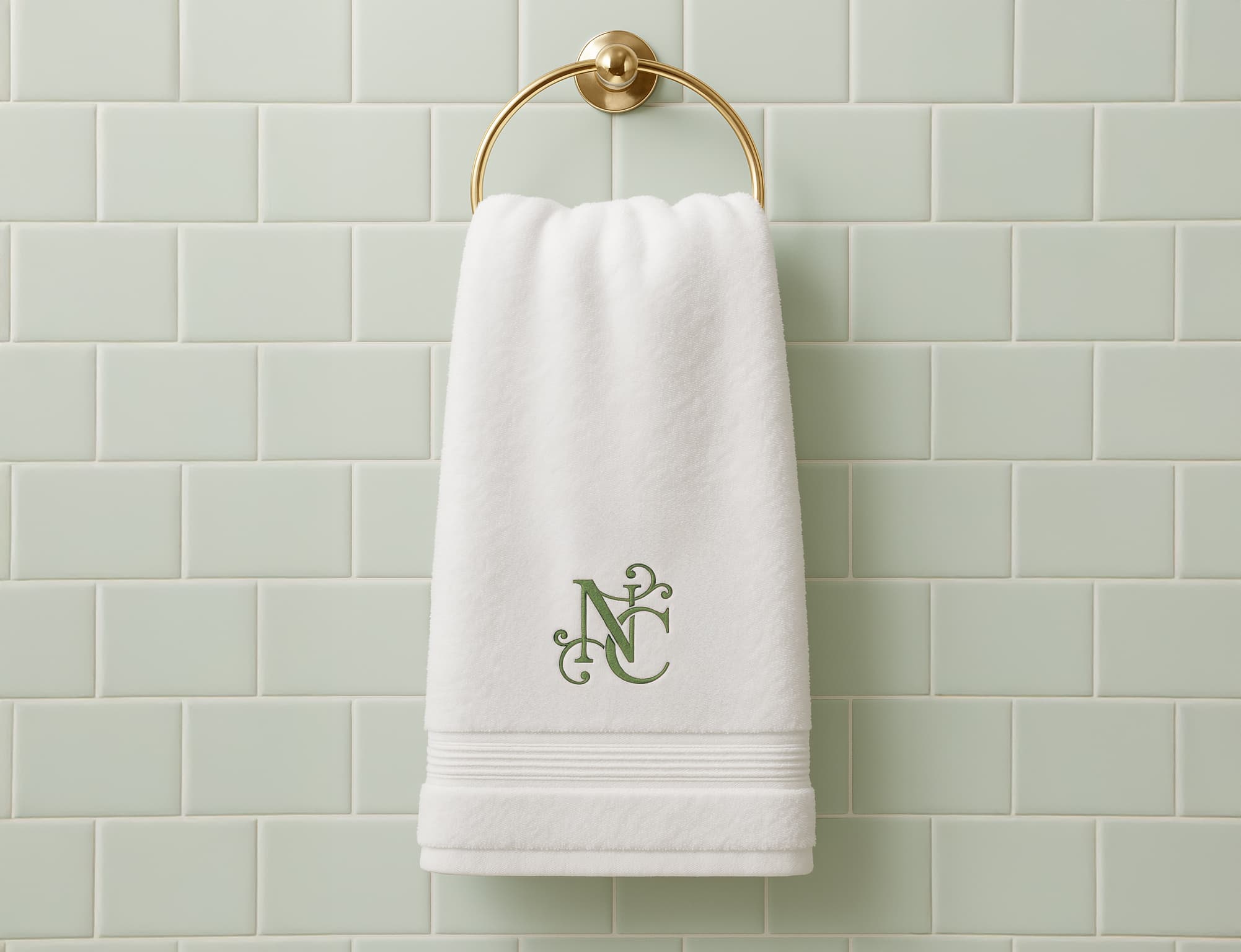 Nurstead Court embroidered towel logo showcasing luxury hospitality branding and refined brand identity development for a premium venue