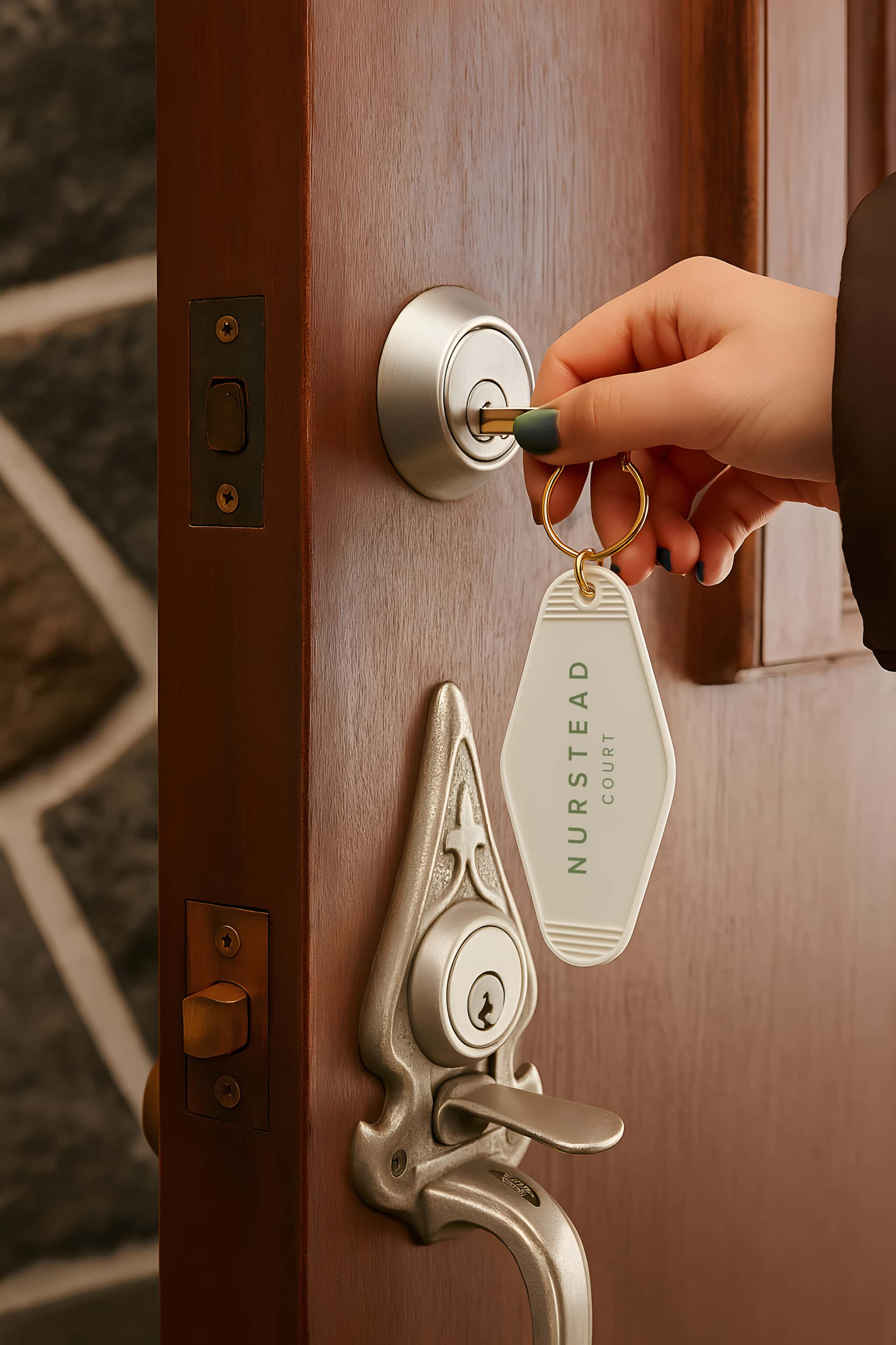 Nurstead Court branded key holder showcasing luxury hospitality brand identity and thoughtful guest experience design for a premium venue
