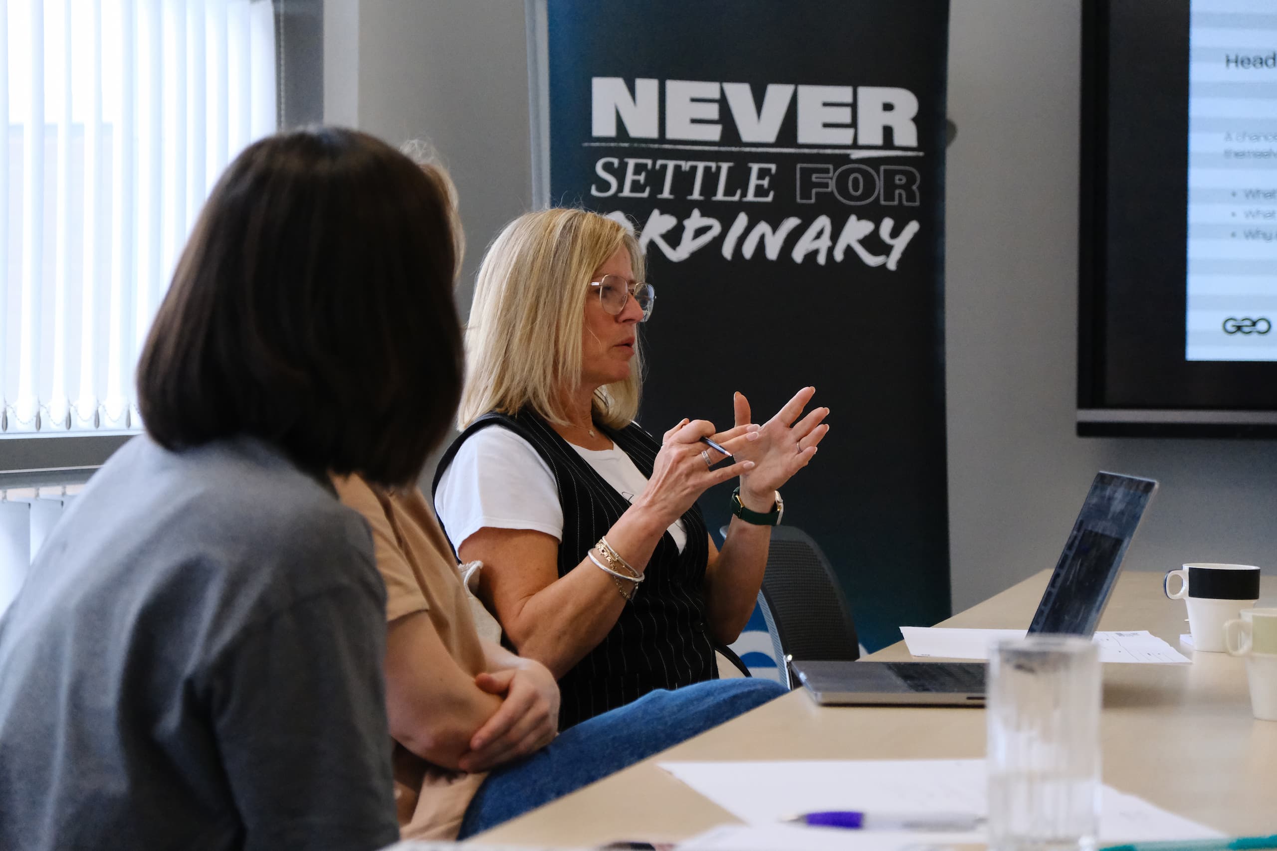 Two participants discussing ideas during brand strategy and positioning workshop