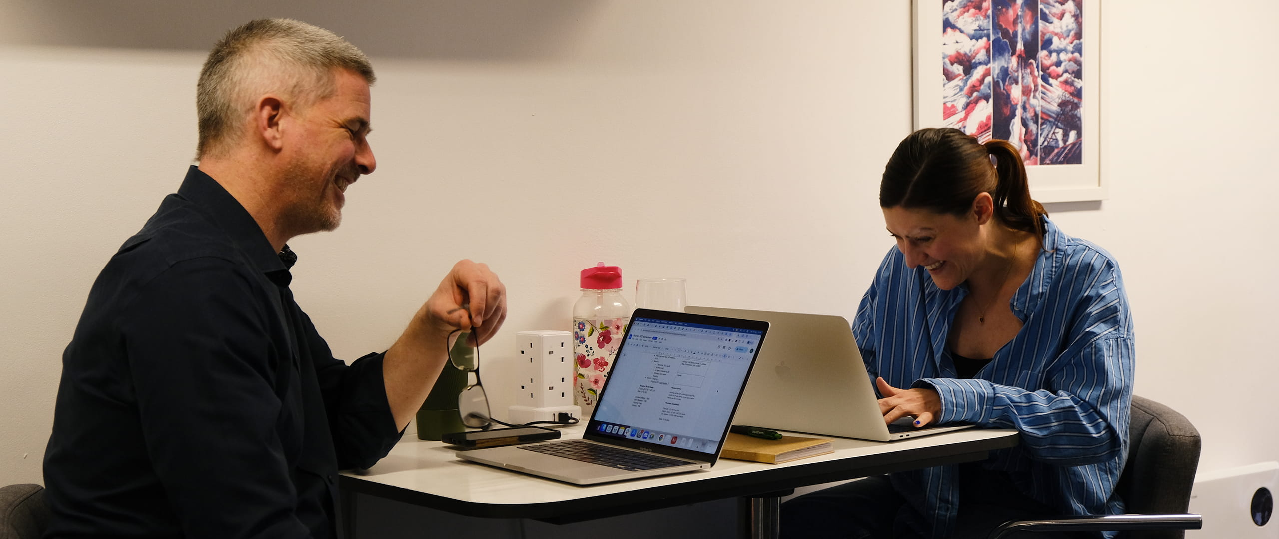 account and operations managers reviewing client relationship management at desk