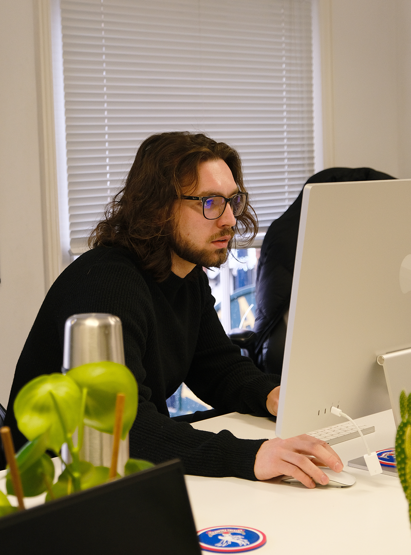 web designer working on website design at computer